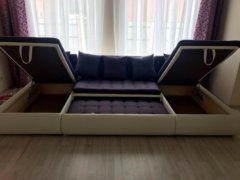 Модульный диван Кормак в разложенном виде фотографии ящиков для белья